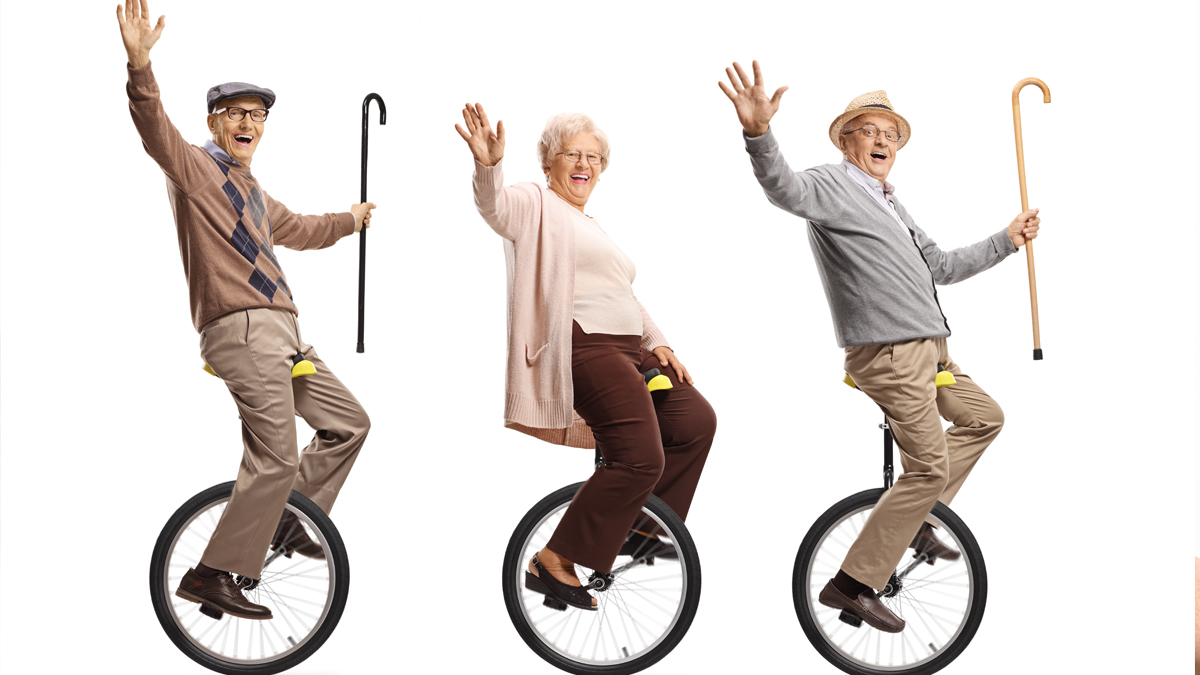Keeping Your Balance. Photo of seniors on unicycles.