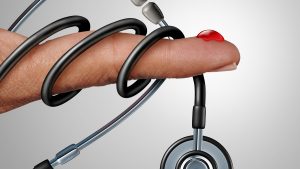 Diabetes: a drop of blood on the finger and a doctor's stethoscope