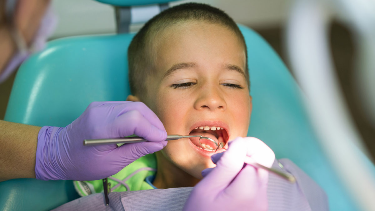 Boy at Dentist Getting Cavity Checkup