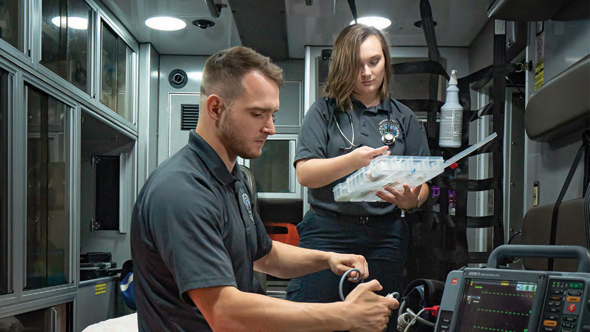 EMT's workers using medical equipment