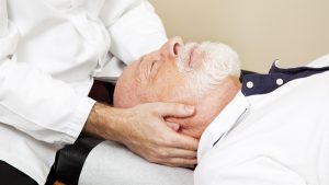 Chiropractor treating patient