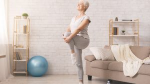 Older woman stretching before exercising