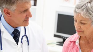 Doctor talking to senior about aging
