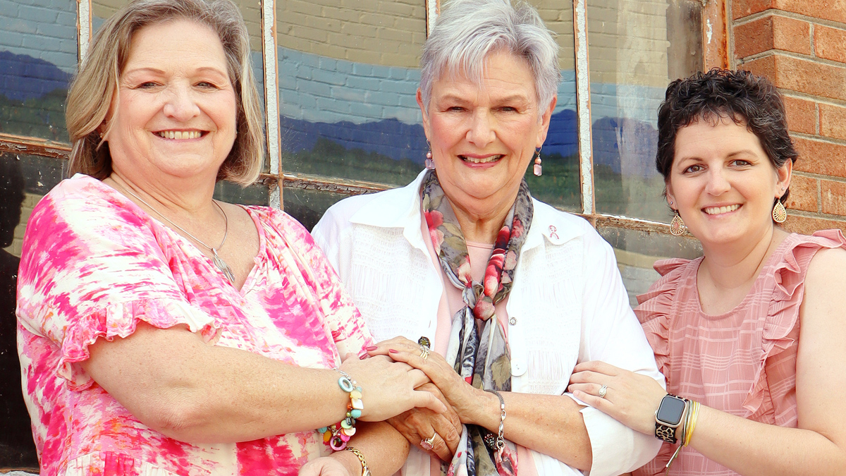 Photo of Lynne, Cathy and Caitlyn who are breast cancer survivors