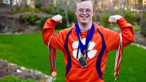 Photo of Rion with his Special Olympics medals