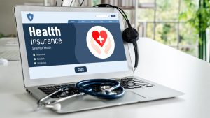 Photo of a computer screen with health benefits and a stethoscope