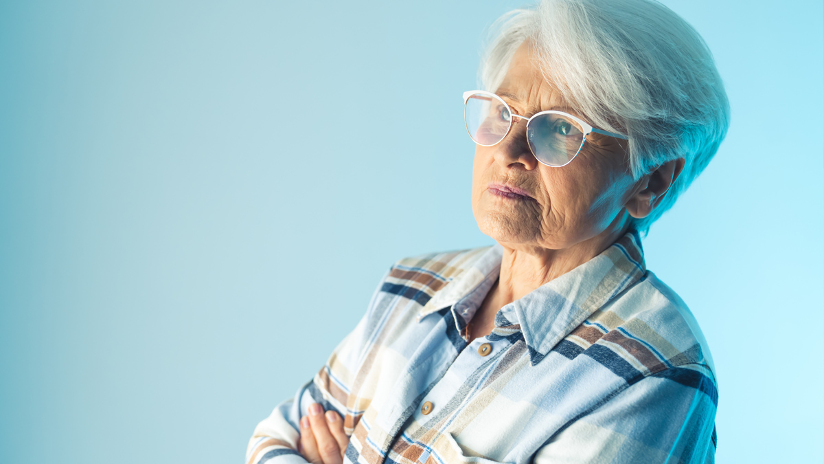 Photo of an older woman who is looking off into the distance